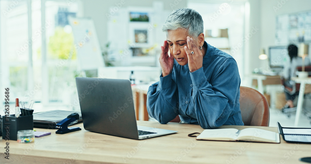 Mature, frustrated woman or headache with laptop for stress, deadline or strain at office desk. Senior, female person or migraine with anxiety, debt or bankruptcy for pain, vertigo or dizziness Mature, frustrated woman or headache with laptop for stress, deadline or strain at office desk. Senior, female person or migraine with anxiety, debt or bankruptcy for pain, vertigo or dizziness