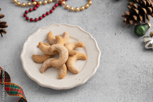 Delicious homemade Christmas cookies. Festive decorated sweets with decorations. Vanillekipferl are Austrian crescent-shaped biscuits made from almonds and hazelnuts. Austrian German cuisine photo