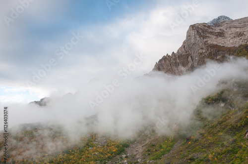 Landscape view of Fisht-Oshten massif covered with thick fog in the morning, Republic of Adygea, Russian Federation