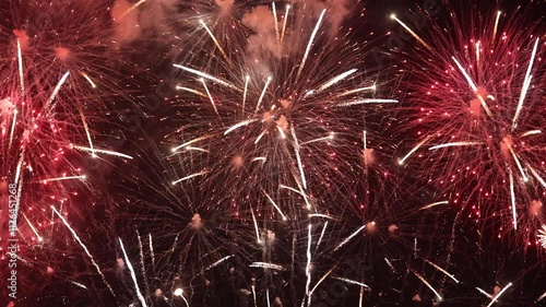 Amazing real beautiful colorful fireworks background on celebration night event for happy new year party, Abstract Multi color golden firework in the night sky