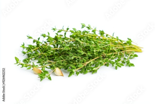 Fresh thyme and garlic cloves ready for culinary use in cooking or garnishing dishes in a kitchen setting