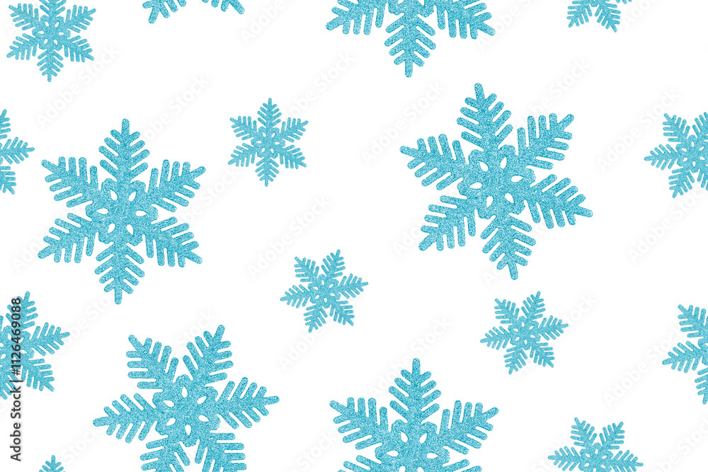 Seamless pattern made of top view of traditional shiny glittering snowflakes christmas bauble or new year decoration of blue colour isolated on white background used for winter holiday greeting decor Seamless pattern made of top view of traditional shiny glittering snowflakes christmas bauble or new year decoration of blue colour isolated on white background used for winter holiday greeting decor