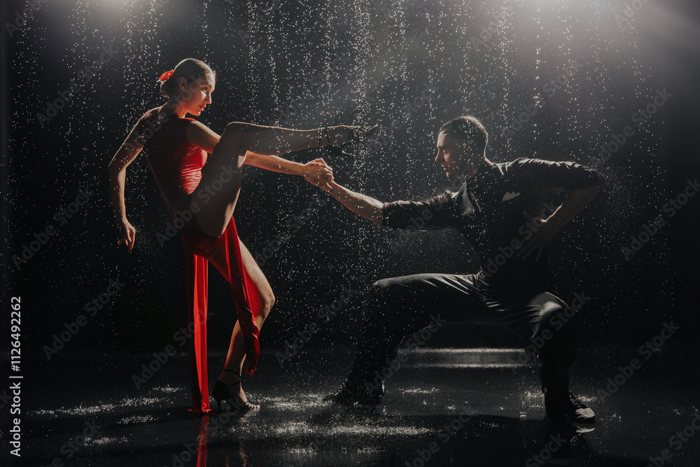 A couple of dancers on a black background in a studio in the aqua zone A couple of dancers on a black background in a studio in the aqua zone