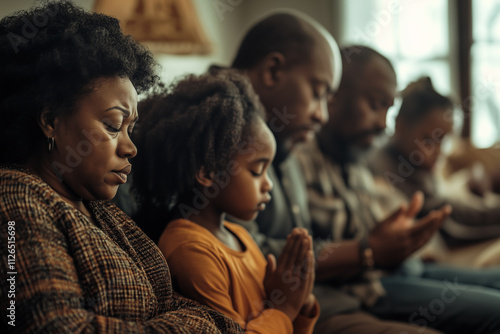 African family praying for god.