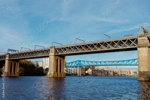 Newcastle UK:29th Oct 2024. River Tyne famous bridges on sunny winter afternoon during golden hour. King Edward VII Bridge railway crossing