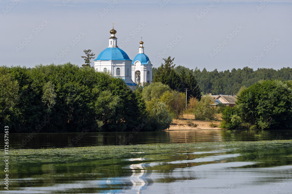Church of the Nativity of the Blessed Virgin Mary, Sumki village, Mari El Republic, Russia. View from the Volga River on the Orthodox church. Architectural landmark. Water travel along the Volga. Church of the Nativity of the Blessed Virgin Mary, Sumki village, Mari El Republic, Russia. View from the Volga River on the Orthodox church. Architectural landmark. Water travel along the Volga.