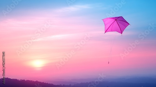 A kite shaped like a pink umbrella flies over a soft gradient sunset sky. 