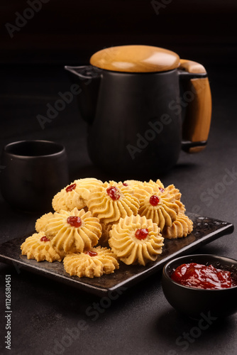 Kue Semprit or Butter Cookies, Topping  with Strawberry Jam. photo