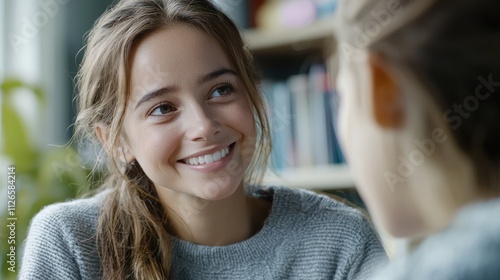 Obraz na płótnie Close-up of a teacher nodding and encouraging a student with a supportive smile w salonie