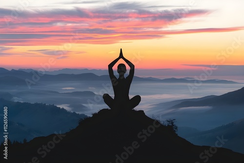 silhouette of a person sitting on a mountain