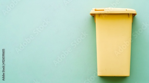 Single Recycling Bin with Pale Green Backdrop photo