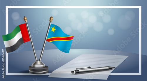 United Arab Emirate and Congo National flags on small table with bokeh background, cooperative relationship
