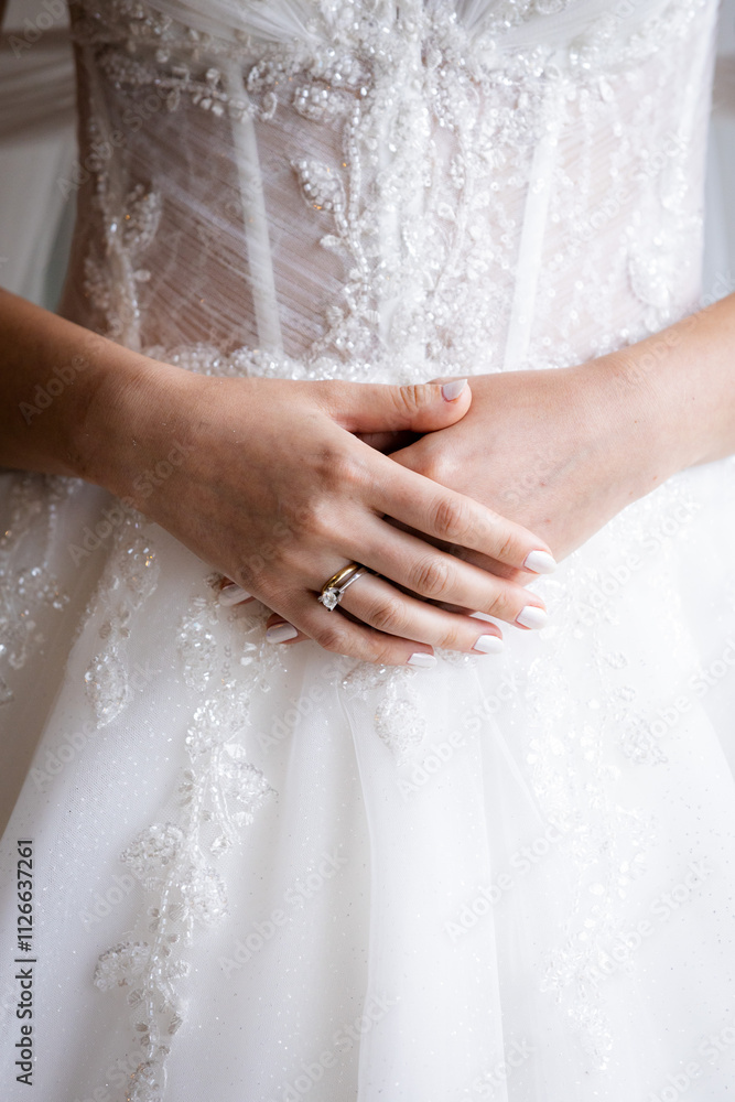 Elegant Bride with Lace Wedding Gown and Simple Wedding Band Closeup Elegant Bride with Lace Wedding Gown and Simple Wedding Band Closeup