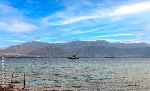 Motorboat approaching to a beach in the gulf of Aqaba, bliss vacation on the ...