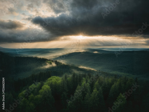 Landscape with a view of the taiga in cloudy weather. Clouds over a coniferous forest. Gloomy landscape on the theme of nature.