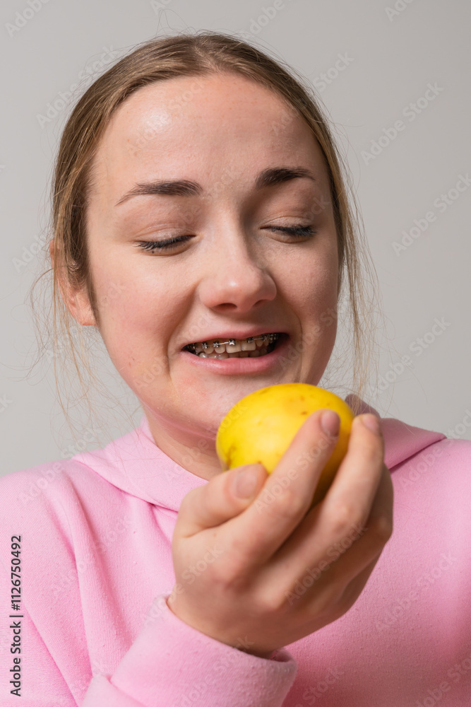 Girl with braces eat apple fruit Girl with braces eat apple fruit