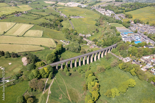 Принти на полотні Aerial drone photo of the town of Thornton which is a village within the metropolitan borough City of Bradford in West Yorkshire, England showing the village and famous viaduct in the summer time