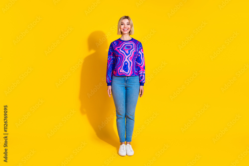 Full size photo of pretty young girl model black friday shopping wear trendy colorful blue outfit isolated on yellow color background Full size photo of pretty young girl model black friday shopping wear trendy colorful blue outfit isolated on yellow color background