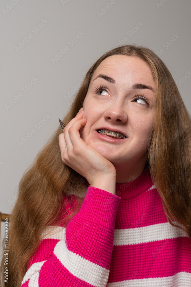 Happy teenager girl smiling on video call during education process Happy teenager girl smiling on video call during education process
