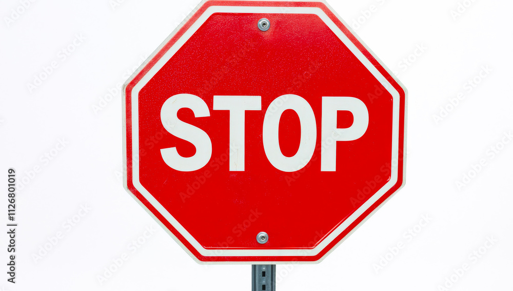 Clear stop sign in urban environment. A bright red stop sign on a post warns drivers at an intersection against a white background. Clear stop sign in urban environment. A bright red stop sign on a post warns drivers at an intersection against a white background.