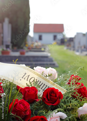 Funeral wreath with dedication in Czech language (saying To Daddy) at a cemetery.