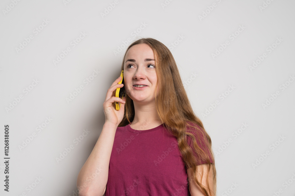 Young beautiful girl uses modern smartphone at home Young beautiful girl uses modern smartphone at home