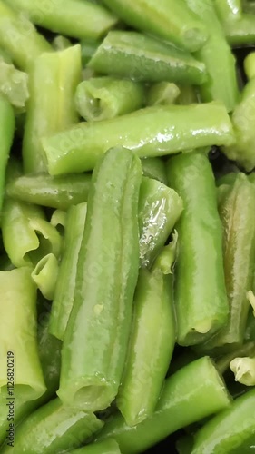 Wallpaper Mural Frozen green beans cooking process. Fresh vegetables fried in olive oil on the pan.  Torontodigital.ca