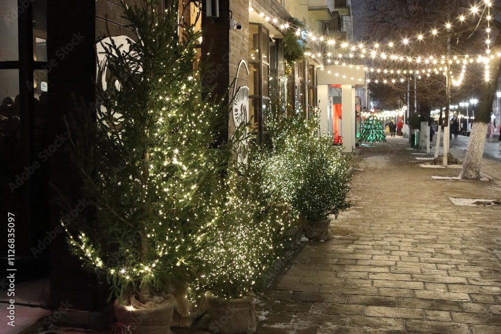 Fototapeta premium New Year's decorations on the street for pedestrians in the city at night