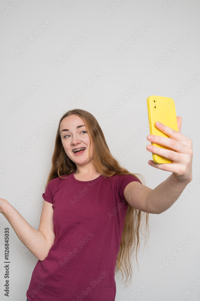 Young beautiful girl uses modern smartphone at home Young beautiful girl uses modern smartphone at home