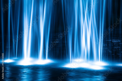 A radiant neon background with cascading light trails in blue and white, forming an abstract waterfall effect.