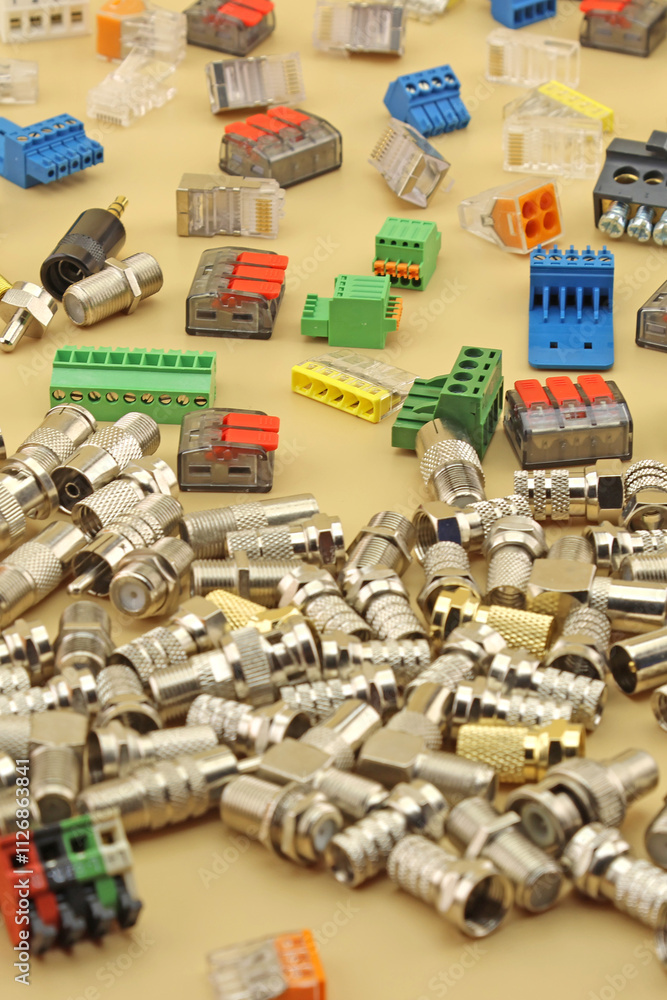 Metal F-connectors for connecting coaxial cable. Close-up. Soft focus. Metal F-connectors for connecting coaxial cable. Close-up. Soft focus.
