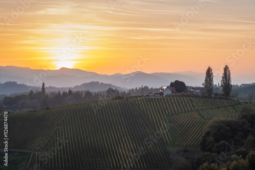 Aerial sunset landscape of the picturesque, autumn-covered hills near Maribor, close to the Austrian border in Slovenia.. photo