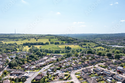 Obraz na płótnie Aerial drone photo of the village of Kirkheaton, Huddersfield in the Kirklees district in the county of West Yorkshire England showing the village and River Calder from above in the summer time. w salonie