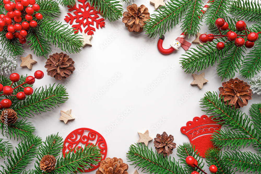 Christmas background. Christmas eve concept. Top view of gift boxes, fir branches, toys, on white background.