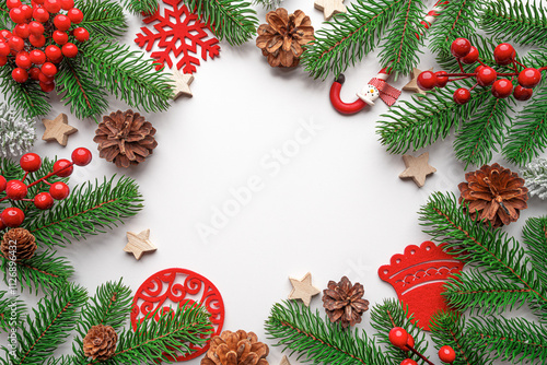 Christmas background. Christmas eve concept. Top view of gift boxes, fir branches, toys, on white background.
