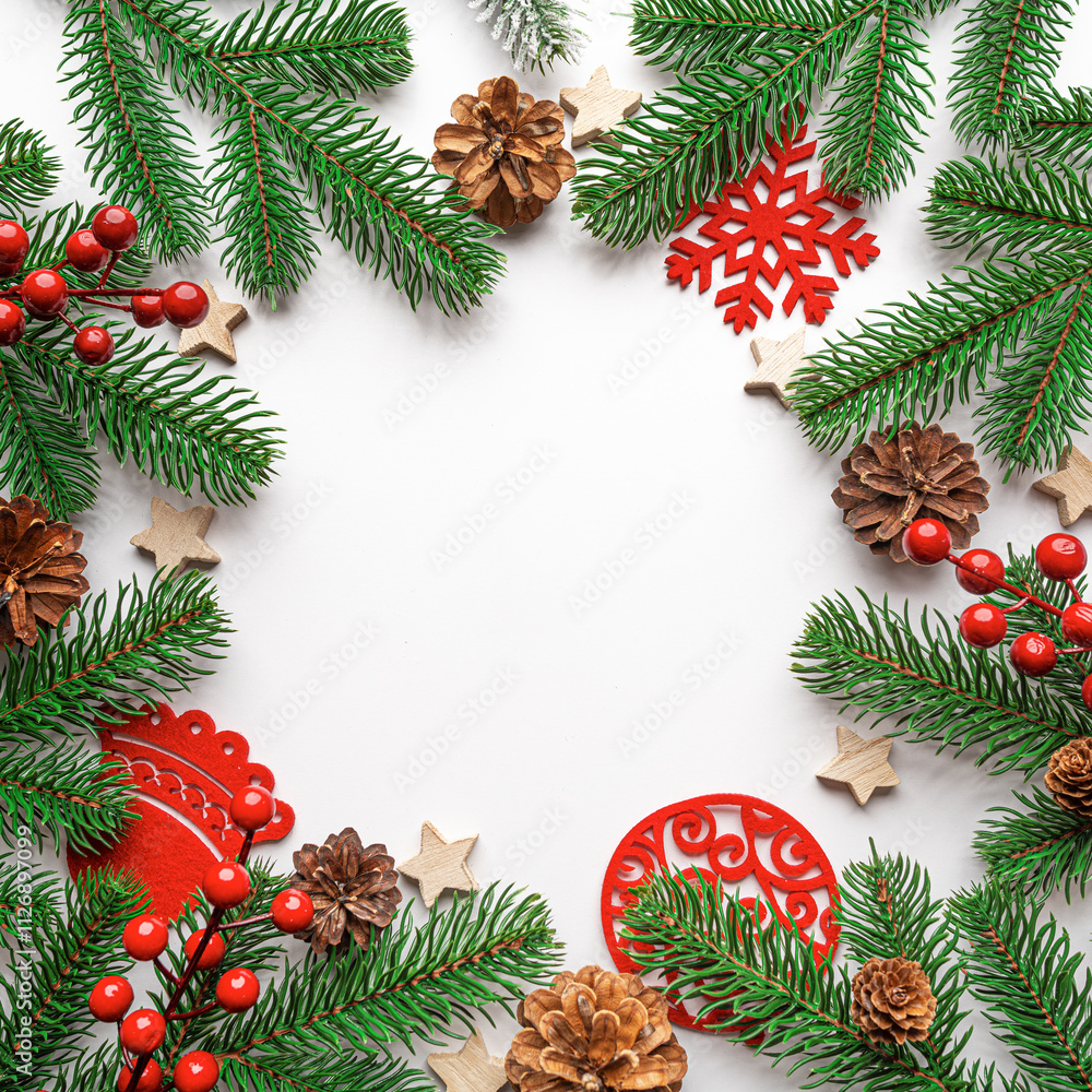 Christmas background. Christmas eve concept. Top view of gift boxes, fir branches, toys, on white background.