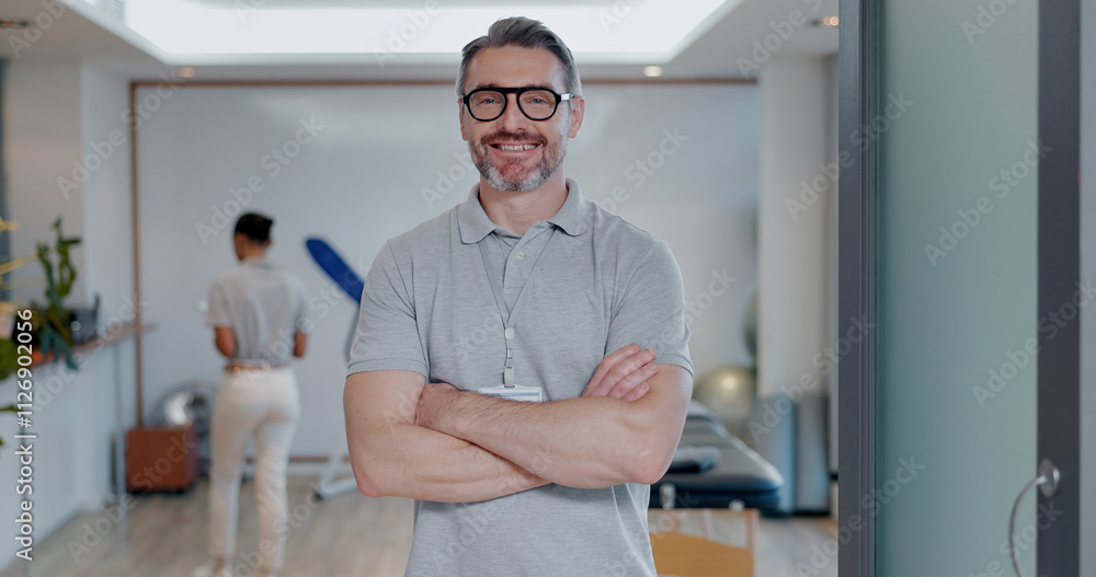 Portrait, happy man and confidence as physiotherapist in gym, rehabilitation clinic or wellness practice. Male person, pride and arms crossed with smile, personal trainer or coach for physio exercise Portrait, happy man and confidence as physiotherapist in gym, rehabilitation clinic or wellness practice. Male person, pride and arms crossed with smile, personal trainer or coach for physio exercise