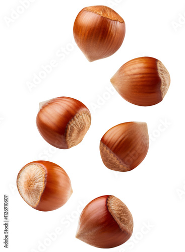 Wallpaper Mural Six hazelnuts cascading in front of a clear backdrop, ideal for culinary and drink concepts Torontodigital.ca