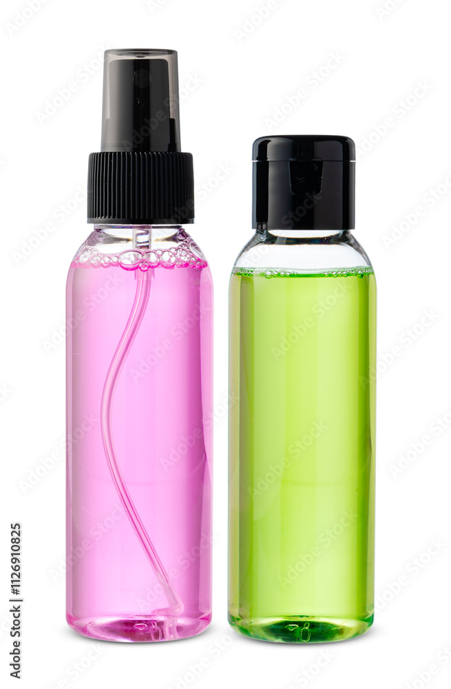 Various bottles with colored liquids and pumps arranged on white background Various bottles with colored liquids and pumps arranged on white background