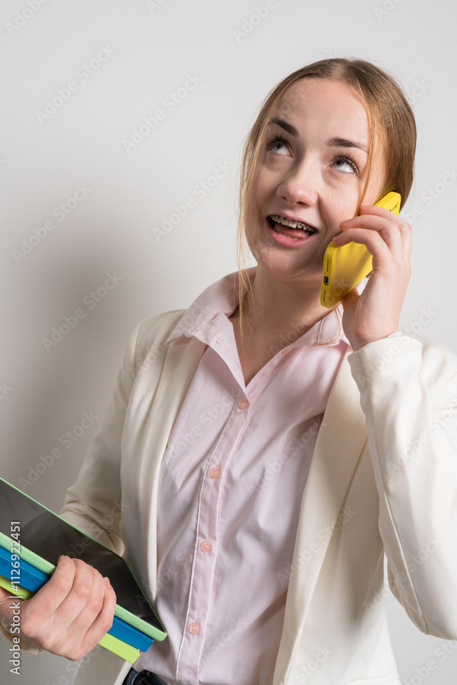 Business woman with braces, with gadgets at work