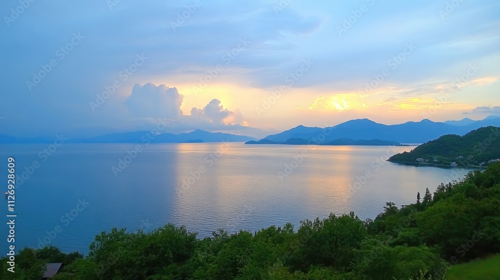 Serene Sunset Over Calm Lake with Mountains in the Background Serene Sunset Over Calm Lake with Mountains in the Background