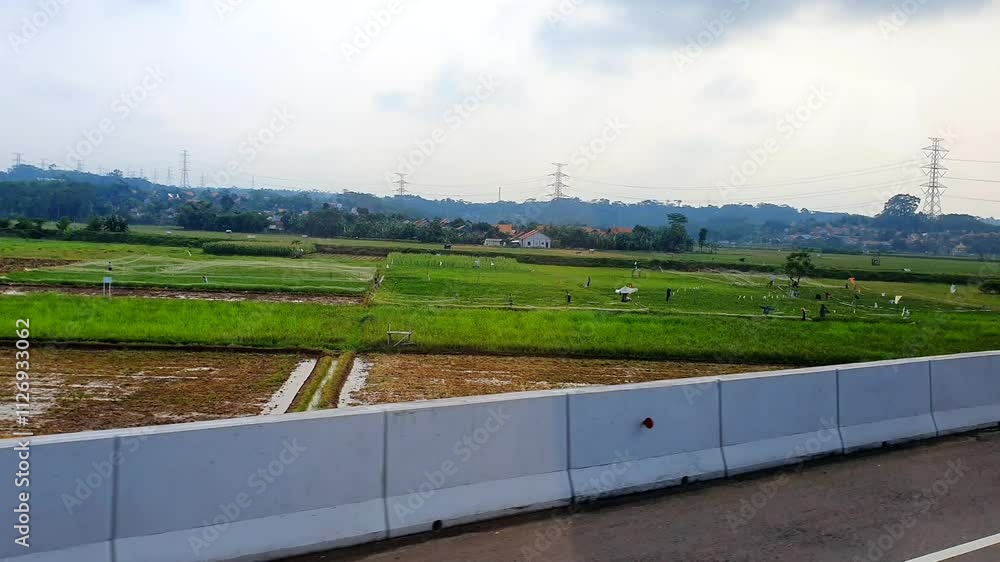 POV of sightseeing a landscape through the window from inside a moving bus on a toll road. Concept of vacations and travel POV of sightseeing a landscape through the window from inside a moving bus on a toll road. Concept of vacations and travel