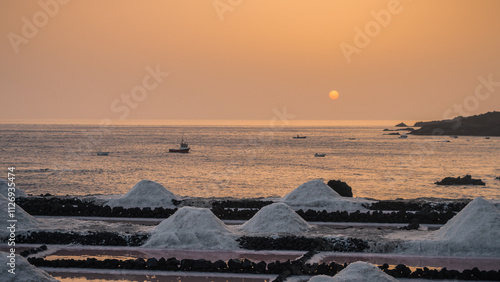 Sunset over Salt Flats and Ocean Horizon with Fishing Boats, La Palma, Canary Islands