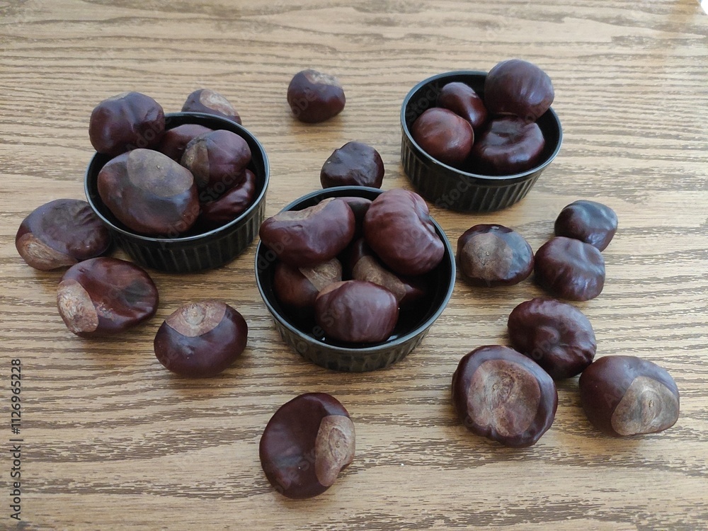Shiny brown chestnuts on the table