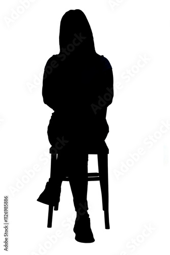 front view of the silhouette of a women sitting on a chair with his legs crossed