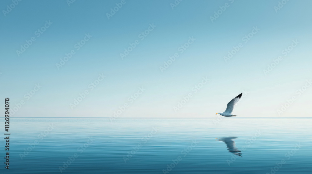Feel free flying concept. A serene scene of a bird flying over calm water, reflecting a clear blue sky, evoking tranquility and freedom. Feel free flying concept. A serene scene of a bird flying over calm water, reflecting a clear blue sky, evoking tranquility and freedom.