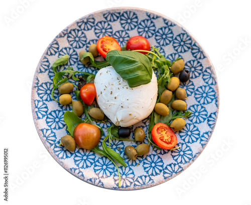 Buffalo mozzarella, olives, tomatoes and basil on a plate with a blue pattern