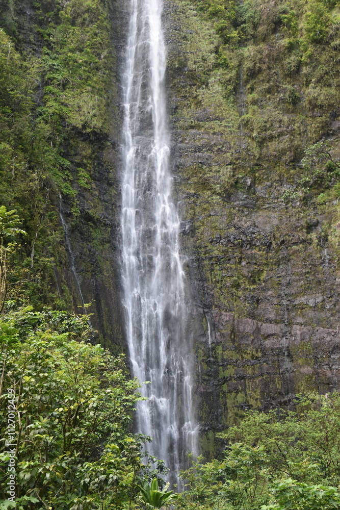 The stunning big wateralls running over the black lava rocks on Maui Island in Hawaii