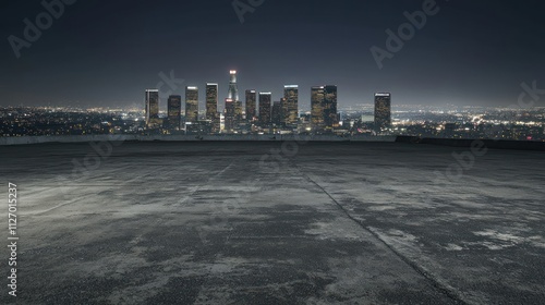A nighttime cityscape view from a rooftop, showcasing a skyline against a dark sky.