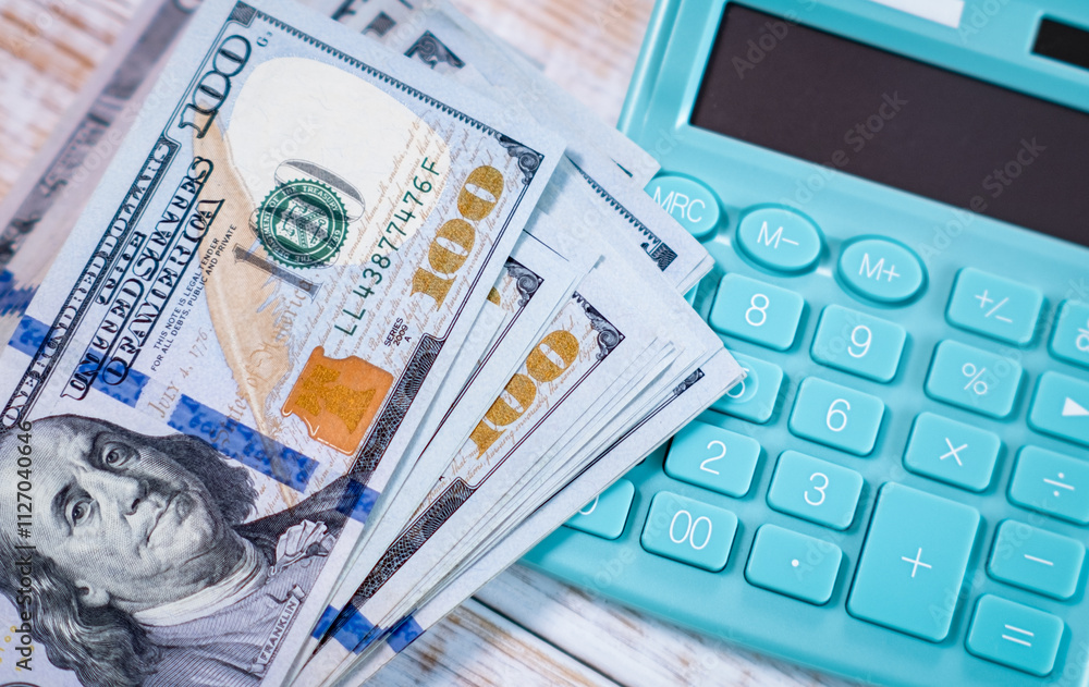 Fototapeta premium Money dollars and calculator, economy concept, money distribution. Euro. The crisis after the covid-19 pandemic. The dollar is falling or rising.